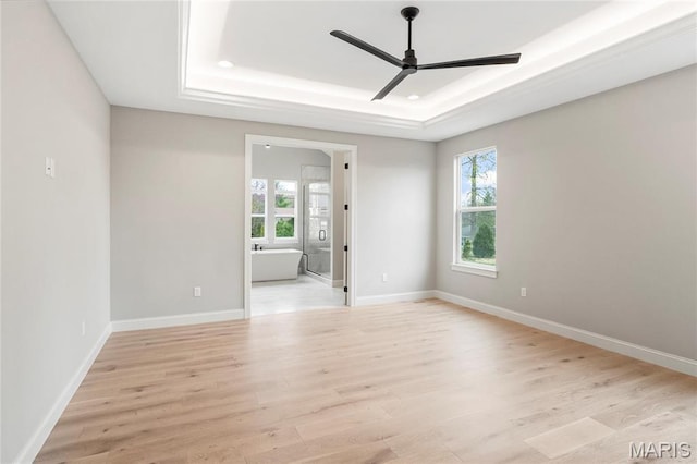 19 Beaver Dr, Creve Coeur, MO 63141 - unfurnished room with a raised ceiling, ceiling fan, light wood-style flooring, and baseboards