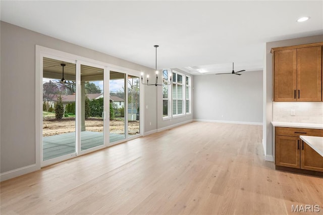 19 Beaver Dr, Creve Coeur, MO 63141 - unfurnished dining area with baseboards, light wood finished floors, ceiling fan, and recessed lighting