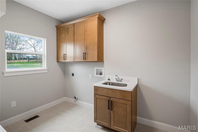 19 Beaver Dr, Creve Coeur, MO 63141 - clothes washing area with hookup for an electric dryer, hookup for a washing machine, cabinet space, and baseboards