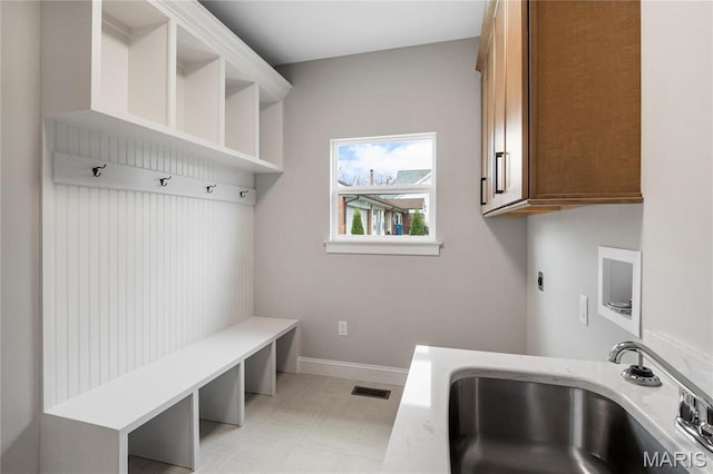 19 Beaver Dr, Creve Coeur, MO 63141 - mudroom with a sink, light floors, and baseboards