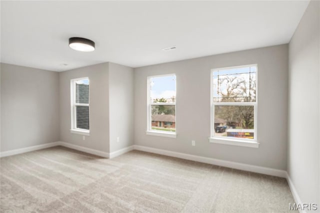 19 Beaver Dr, Creve Coeur, MO 63141 - empty room with baseboards, plenty of natural light, and light carpet