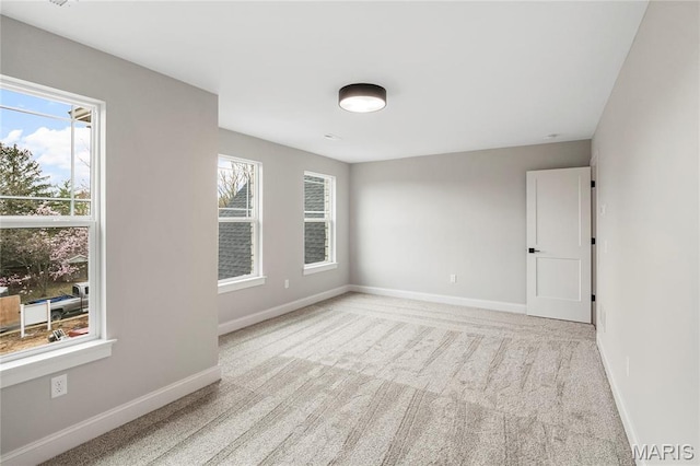 19 Beaver Dr, Creve Coeur, MO 63141 - empty room with plenty of natural light, baseboards, and carpet flooring