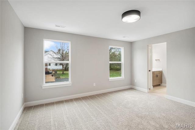 19 Beaver Dr, Creve Coeur, MO 63141 - unfurnished bedroom featuring light carpet, baseboards, and connected bathroom
