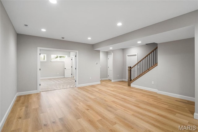 19 Beaver Dr, Creve Coeur, MO 63141 - unfurnished living room with stairway, light wood-style flooring, recessed lighting, and baseboards