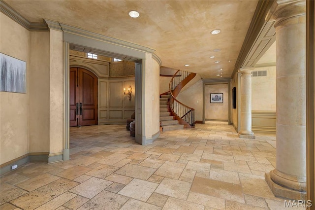 1290 Dry Ridge Rd, Town And Country, MO 63131 - corridor featuring decorative columns, stone tile flooring, recessed lighting, stairway, and crown molding