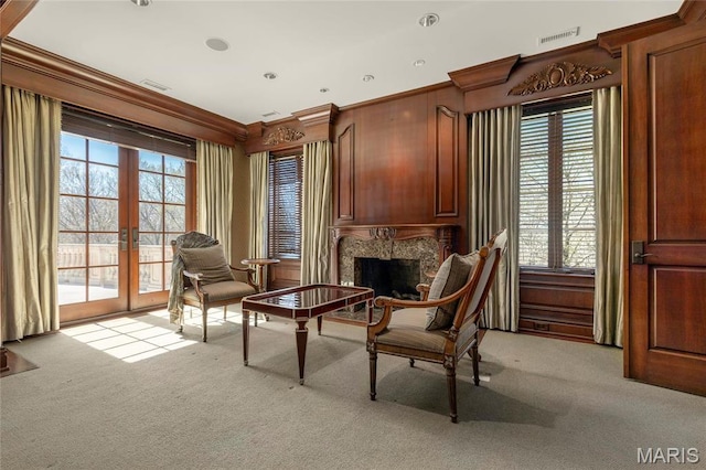 1290 Dry Ridge Rd, Town And Country, MO 63131 - living area with light colored carpet, plenty of natural light, french doors, a premium fireplace, and ornamental molding