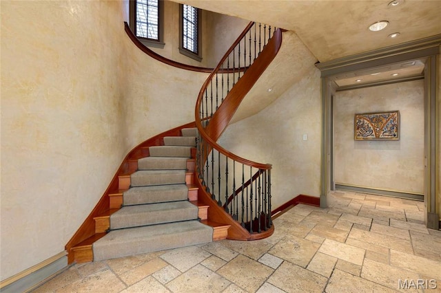 1290 Dry Ridge Rd, Town And Country, MO 63131 - stairs with stone tile flooring and recessed lighting