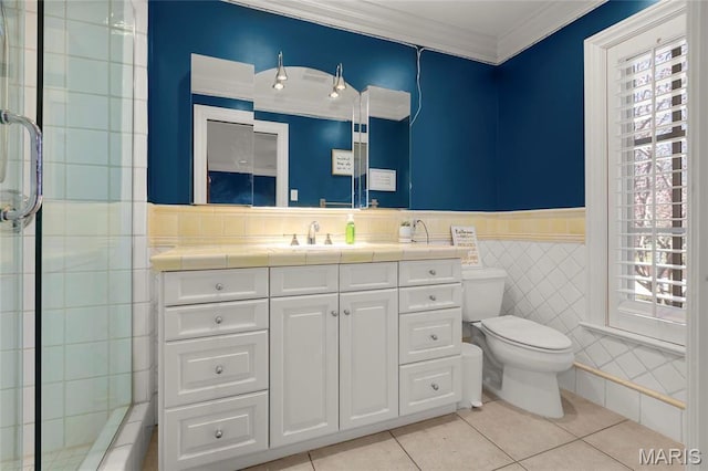 1290 Dry Ridge Rd, Town And Country, MO 63131 - bathroom featuring tile walls, tile patterned flooring, vanity, crown molding, and wainscoting