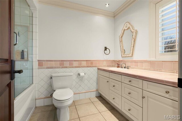 1290 Dry Ridge Rd, Town And Country, MO 63131 - full bathroom featuring crown molding, vanity, a wainscoted wall, tile patterned flooring, and enclosed tub / shower combo
