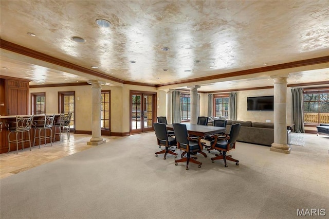 1290 Dry Ridge Rd, Town And Country, MO 63131 - dining room featuring ornate columns, light carpet, crown molding, a community bar, and french doors
