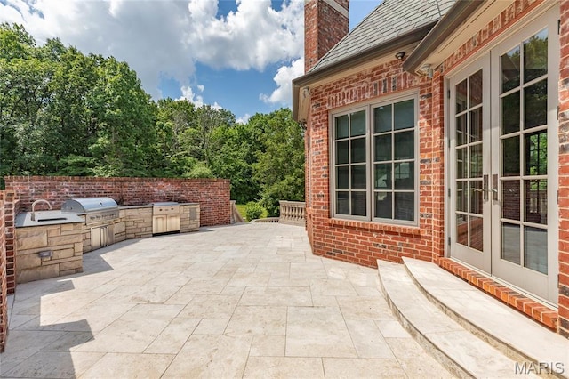 1290 Dry Ridge Rd, Town And Country, MO 63131 - view of patio featuring french doors and an outdoor kitchen