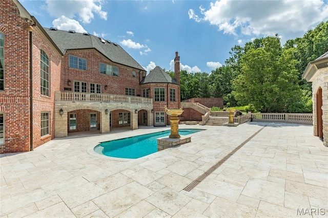 1290 Dry Ridge Rd, Town And Country, MO 63131 - view of swimming pool featuring a patio area
