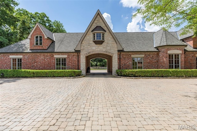1290 Dry Ridge Rd, Town And Country, MO 63131 - view of front of house featuring brick siding and a high end roof