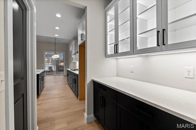 710 Angenette Ave, Kirkwood, MO 63122 - bar featuring light wood-style flooring, pendant lighting, recessed lighting, and gas stovetop