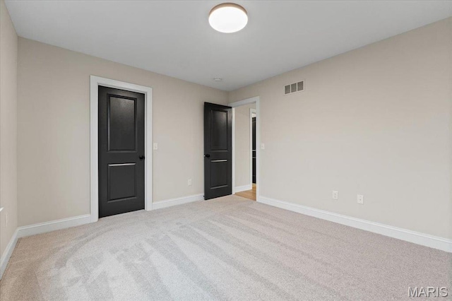 710 Angenette Ave, Kirkwood, MO 63122 - unfurnished bedroom with carpet and baseboards
