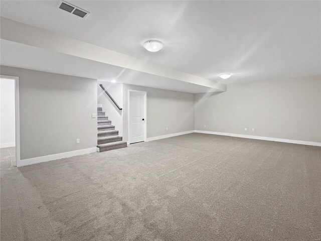 205 Stonebridge Bluff Dr, Maryville, IL 62062 - finished below grade area with carpet flooring, baseboards, and stairway