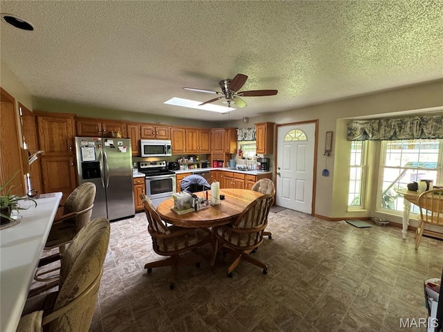 9747 Wayne Route P, Mcgee, MO 63763 - dining area with a ceiling fan, a textured ceiling, and tile patterned floors