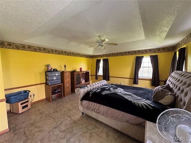 9747 Wayne Route P, Mcgee, MO 63763 - bedroom with a tray ceiling, a textured ceiling, baseboards, and a ceiling fan