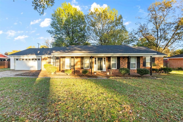 ranch-style house with a garage, driveway, and brick siding