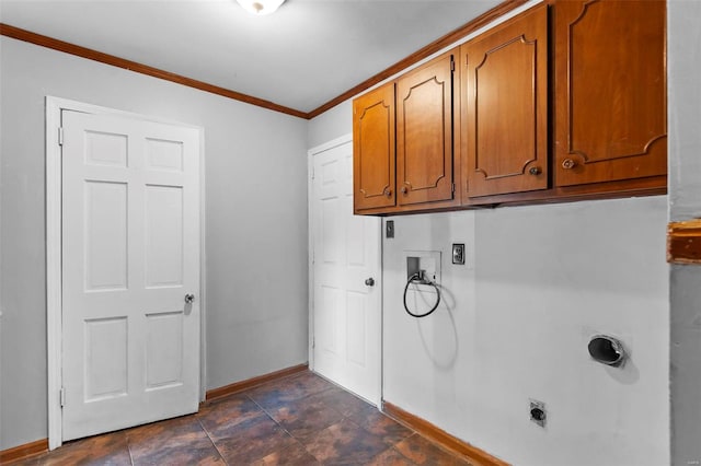 laundry area with cabinet space, ornamental molding, baseboards, washer hookup, and electric dryer hookup