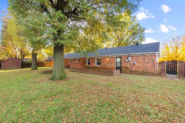 back of property featuring brick siding