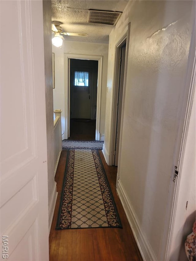 4877 Calvin Ave, Saint Louis, MO 63115 - corridor with wood finished floors and baseboards