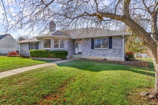 825 Cimarron Cir, Farmington, MO 63640 - ranch-style home with a chimney and a front lawn