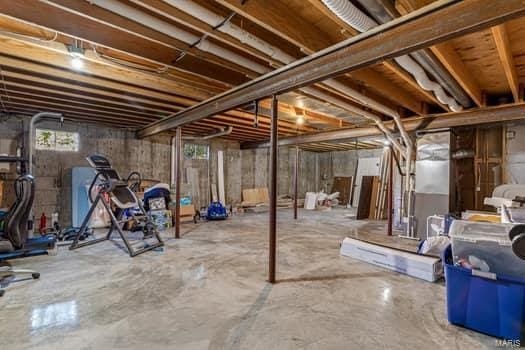 825 Cimarron Cir, Farmington, MO 63640 - below grade area featuring plenty of natural light and heating unit