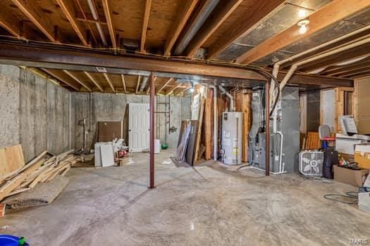 825 Cimarron Cir, Farmington, MO 63640 - unfinished basement featuring gas water heater and heating unit
