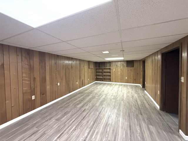 5011 Courtside Dr, Imperial, MO 63052 - finished below grade area featuring wood finished floors, a drop ceiling, baseboards, and wood walls