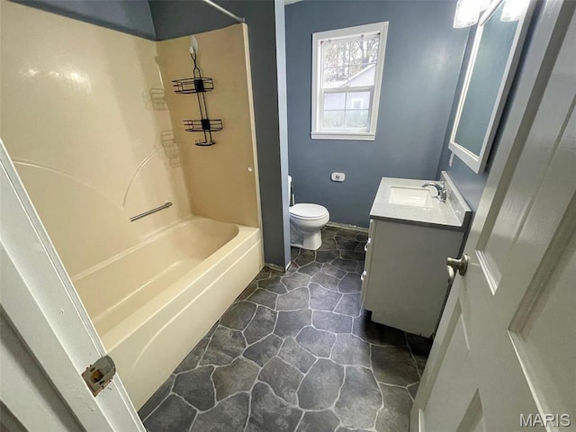 full bathroom with toilet, vanity, shower / bath combination, and baseboards