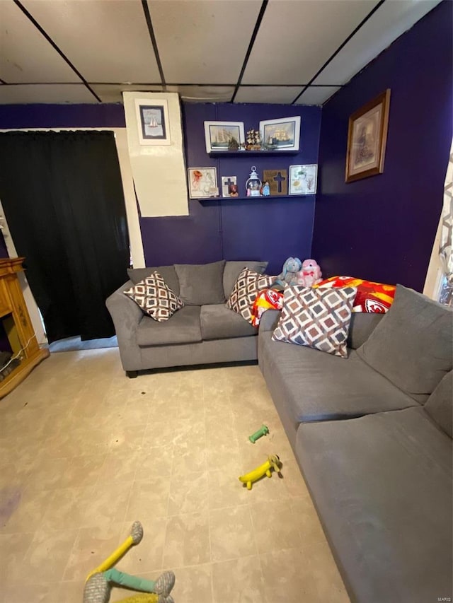 living room with a paneled ceiling