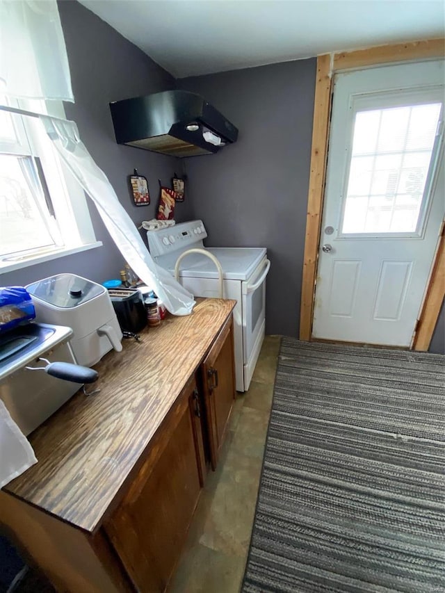 laundry area featuring washer and clothes dryer and cabinet space