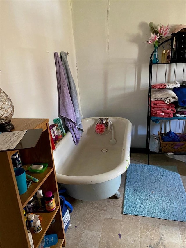 bathroom featuring a soaking tub