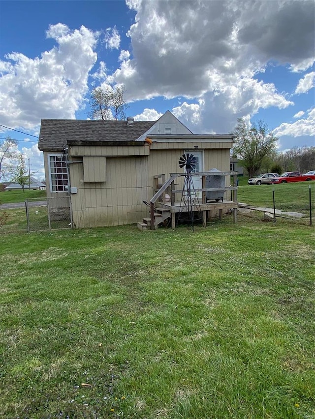 back of property featuring a wooden deck