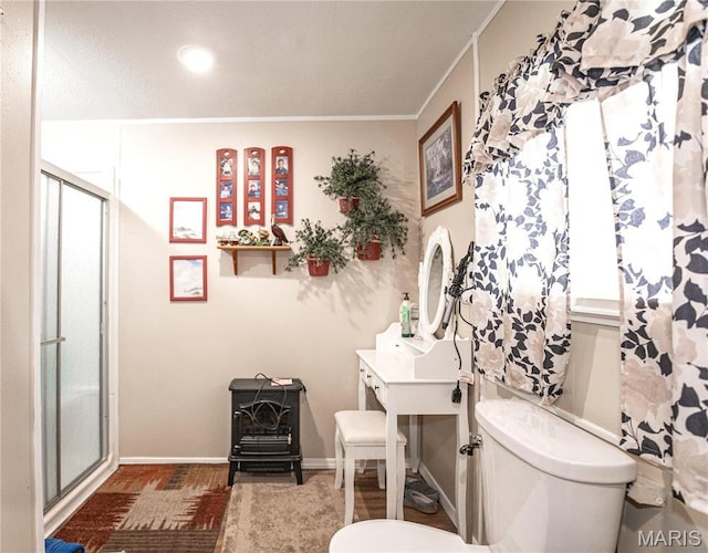 12650 State Route W, Rolla, MO 65401 - bathroom featuring toilet, a stall shower, baseboards, and crown molding