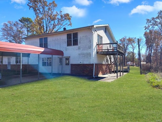 rear view of house with a deck, a lawn, a patio, and stairway
