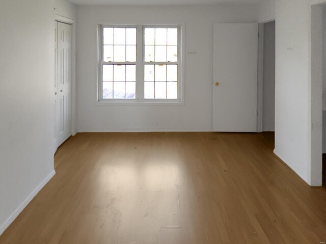 spare room with light wood-style flooring