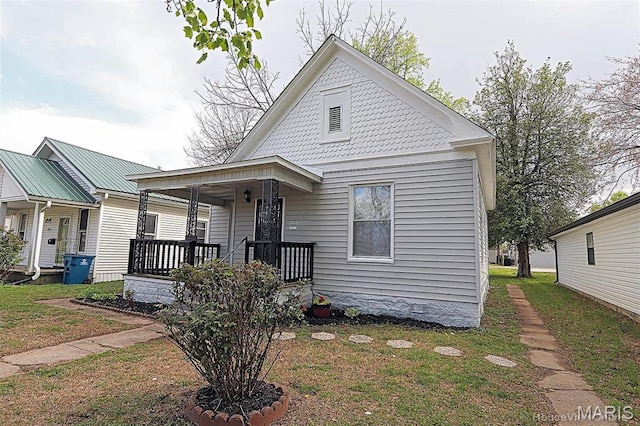 victorian home with a porch and crawl space