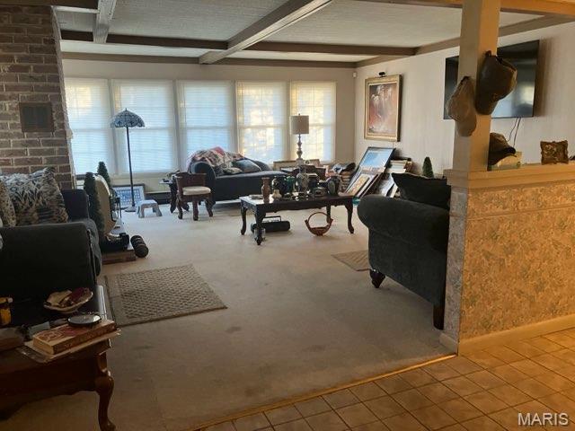 36180 State Highway 25, Malden, MO 63863 - living room featuring tile patterned flooring, carpet floors, and beamed ceiling