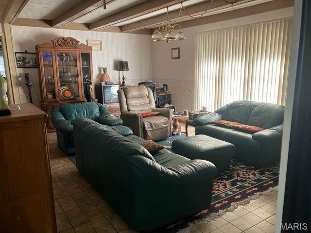 36180 State Highway 25, Malden, MO 63863 - living area with tile patterned flooring, beamed ceiling, and a chandelier