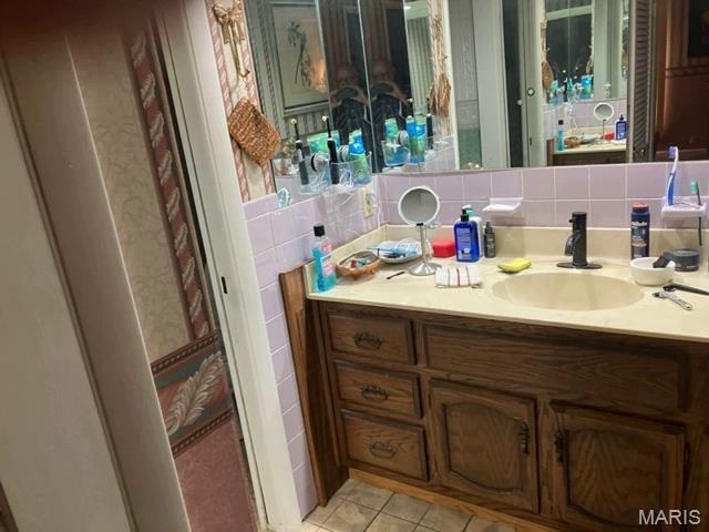 36180 State Highway 25, Malden, MO 63863 - bathroom with vanity and tile patterned floors