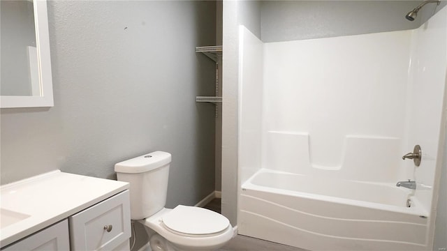 1014 S Klinkhardt St, Hayti, MO 63851 - bathroom featuring toilet, vanity, bathtub / shower combination, a textured wall, and baseboards
