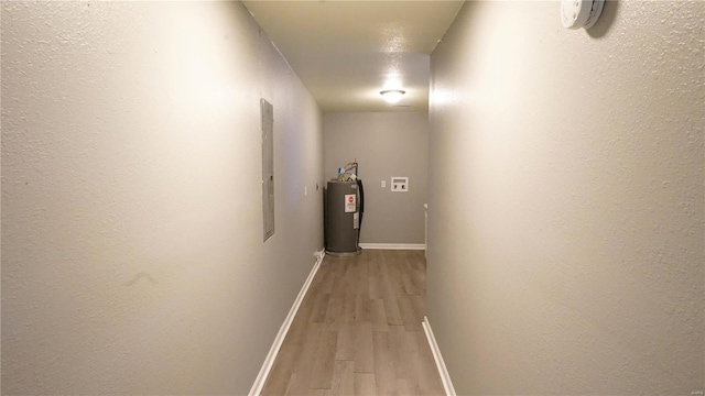 1014 S Klinkhardt St, Hayti, MO 63851 - hallway with water heater, light wood-style flooring, and baseboards