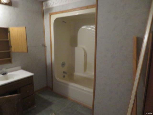 bathroom with vanity and tile patterned floors
