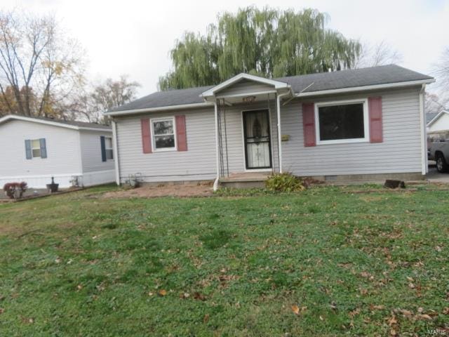 ranch-style home with a front lawn