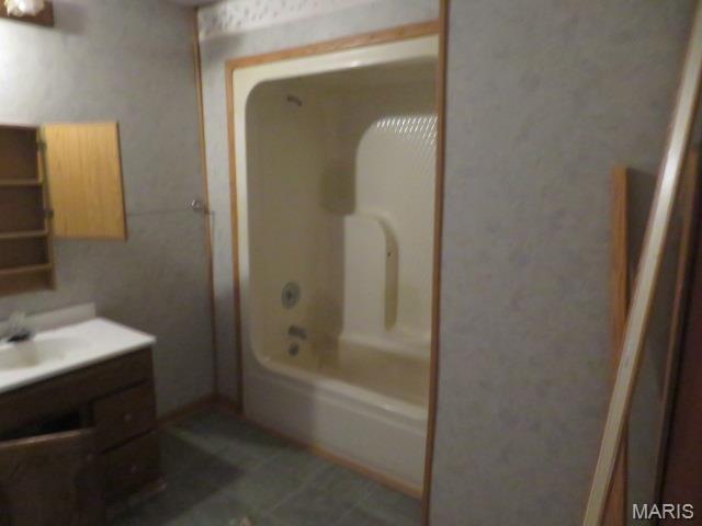 817 S Montgomery Ave, Litchfield, IL 62056 - full bathroom featuring vanity, tile patterned flooring, and washtub / shower combination
