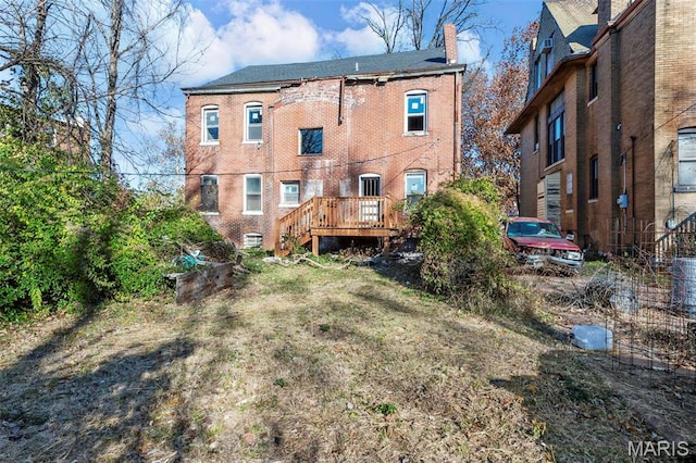 5872 Cabanne Ave, Saint Louis, MO 63112 - rear view of property with a chimney, a wooden deck, and stairs