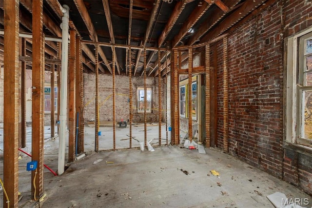 5872 Cabanne Ave, Saint Louis, MO 63112 - miscellaneous room with plenty of natural light and brick wall