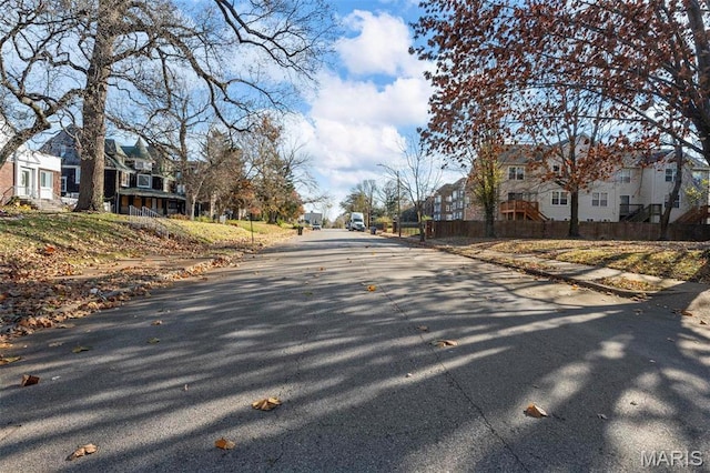 5872 Cabanne Ave, Saint Louis, MO 63112 - view of asphalt road with a residential view, curbs, and sidewalks